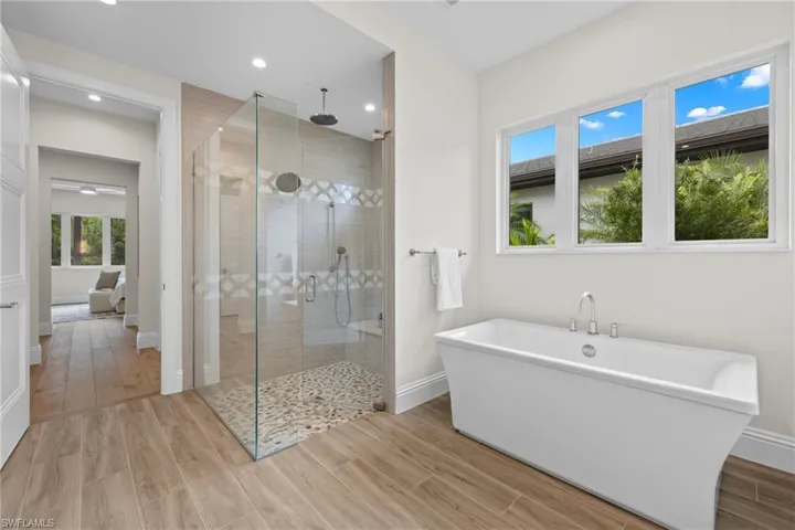 Bathroom featuring separate shower and tub