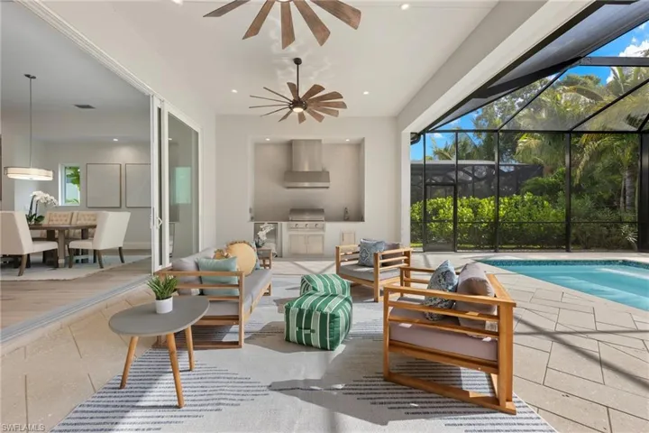Expansive lanai area featuring plenty of natural light, herringbone patio and ceiling fan