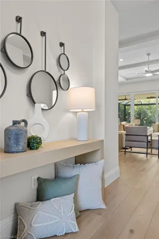 Details with beam ceiling, ceiling fan, and hardwood / wood-style floors
