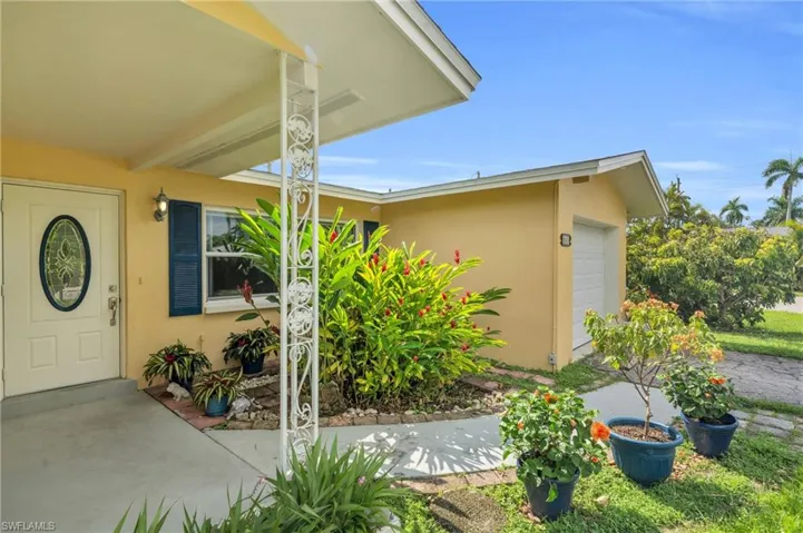 View of exterior entry featuring a garage