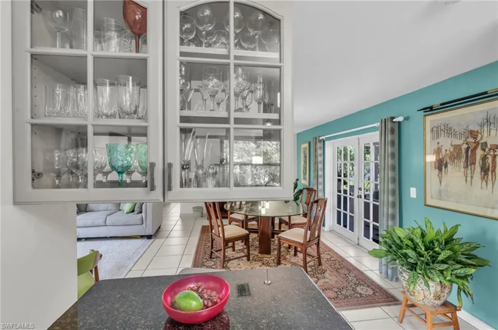 Tiled dining room with french doors