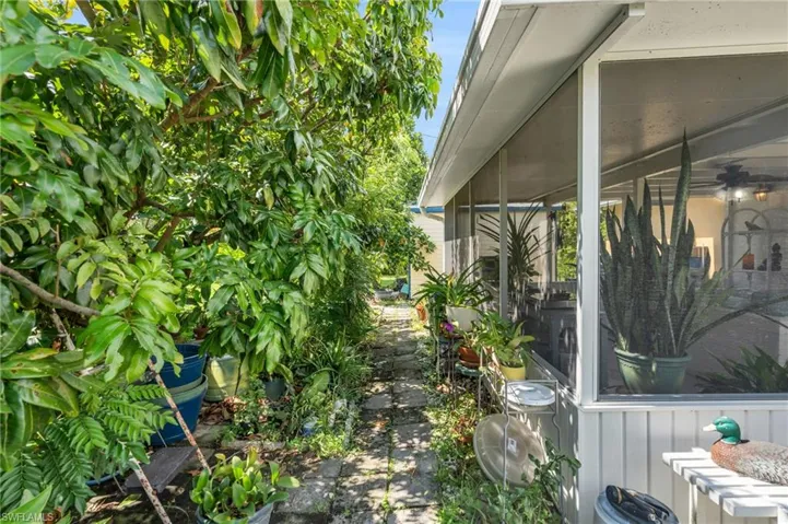 View of yard with a sunroom