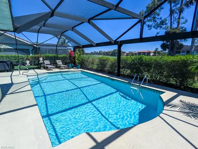 Pool featuring a lanai and a patio