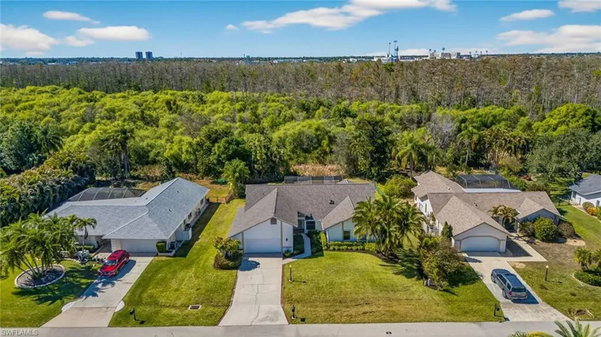 Aerial view of residential area with a forest