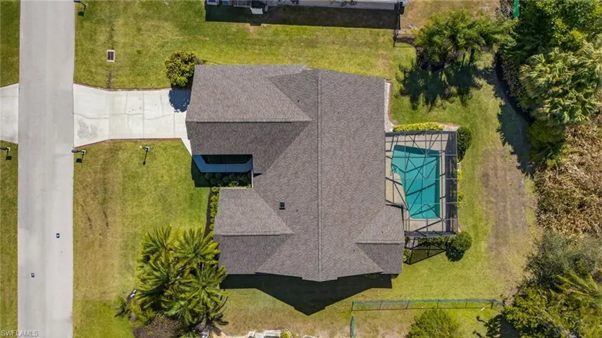 View of subject property with a pool