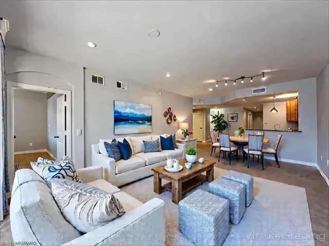 Living area with recessed lighting, baseboards, and visible vents
