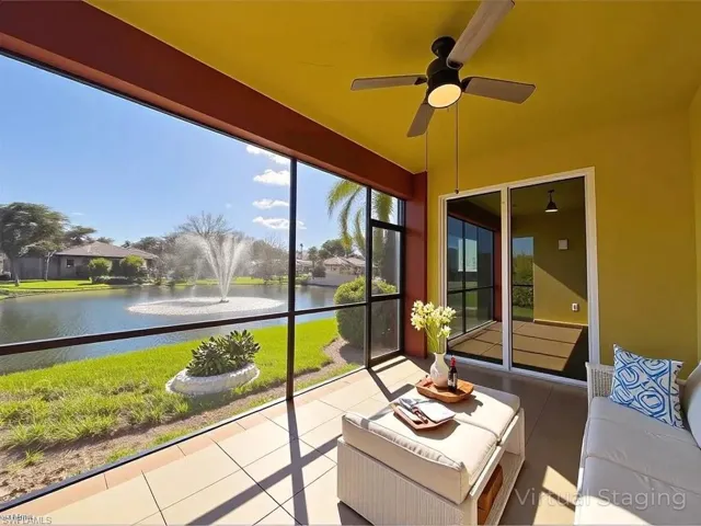 Sunroom with a water view