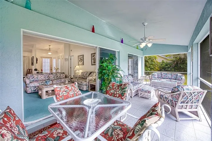View of patio with outdoor lounge area and ceiling fan