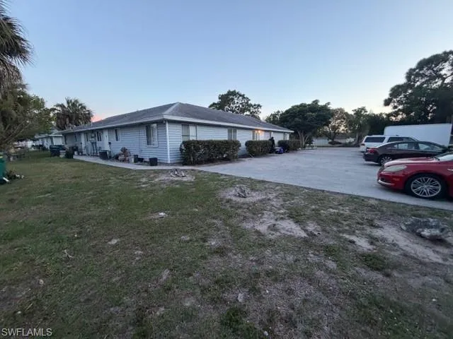 PARKING LOT VIEW AND BACK OF PROPERTY