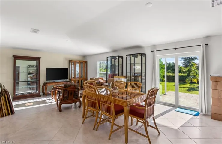 Dining area featuring light tile patterned floors and healthy amount of natural light