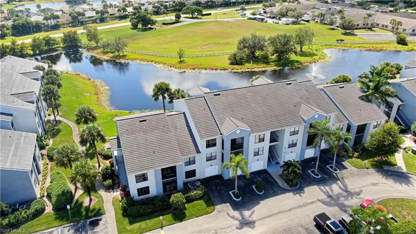 Aerial perspective of suburban area featuring a large body of water