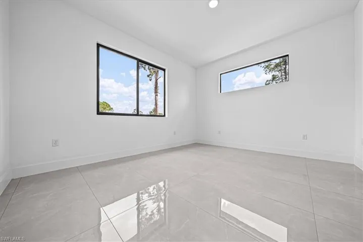 Empty room featuring baseboards