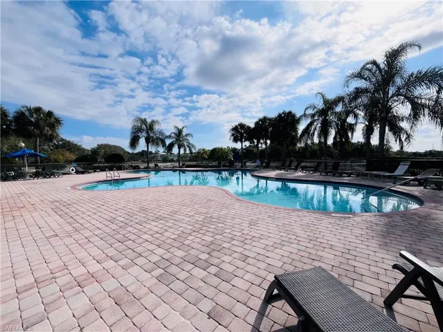 Community pool featuring a patio