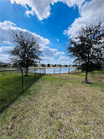 View of yard with a water view