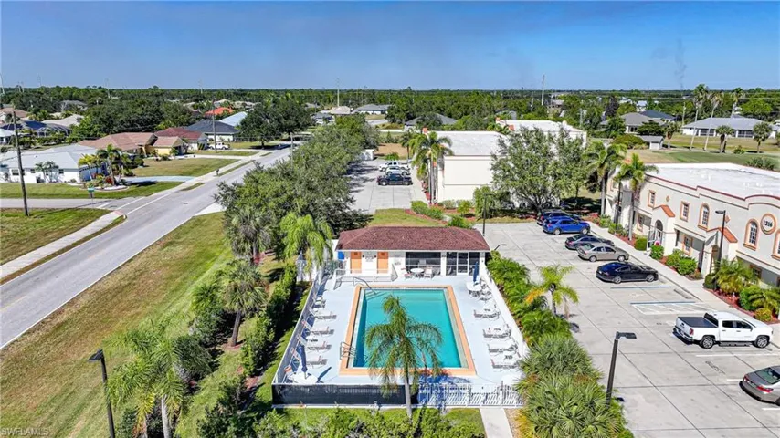 Aerial perspective of suburban area with a pool area