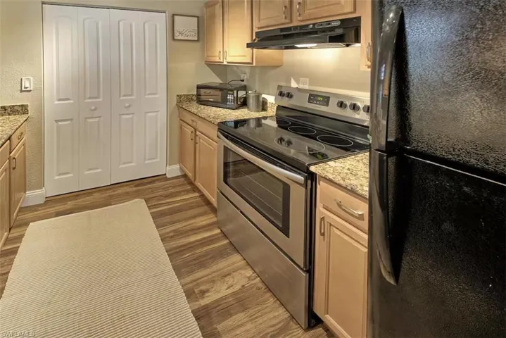 Spacious Kitchen with granite countertops and new floors