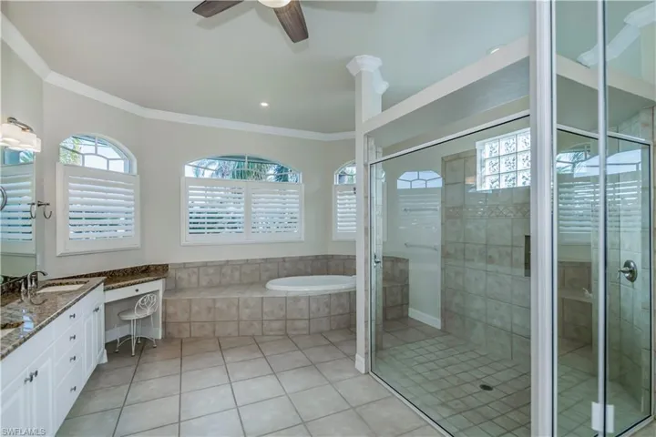 M-Bathroom with shower with separate bathtub, vanity, tile patterned floors, and ornamental molding