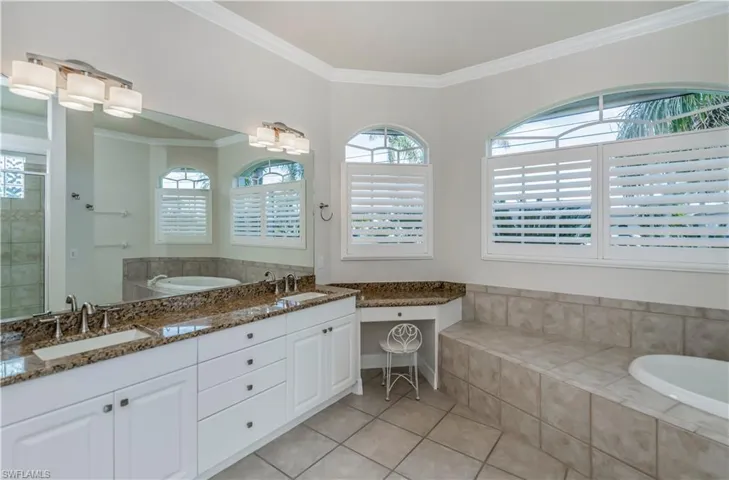 M-Bathroom featuring tile patterned floors, a shower, vanity, and ornamental molding