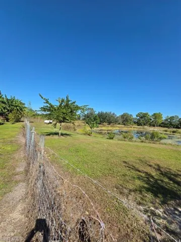 View of grassy yard featuring a water view