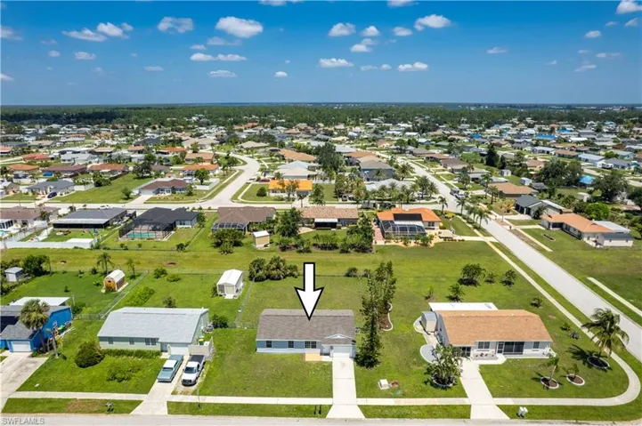 Birds eye view of property with a residential view