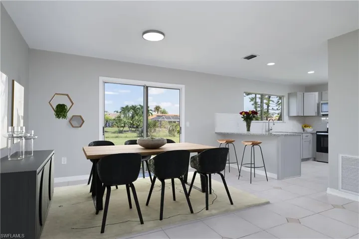 Dining space with recessed lighting, Virtually Staged visible vents, baseboards, and light tile patterned floors