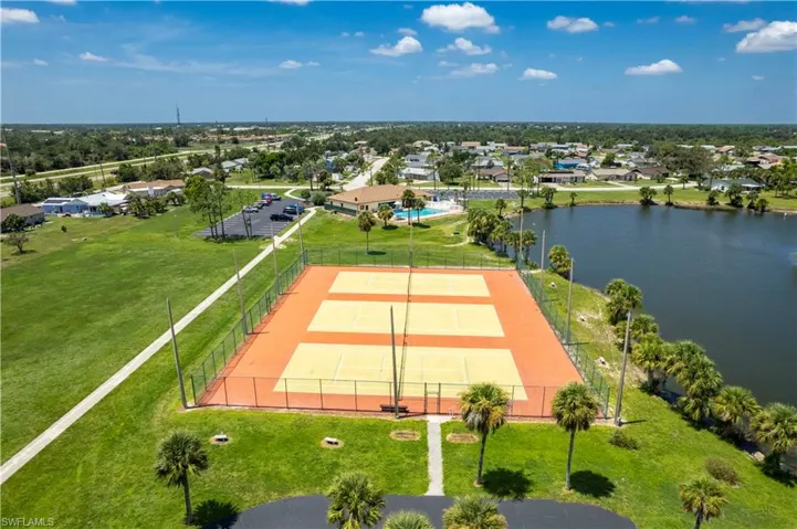 Drone / aerial view with a water view and a residential view