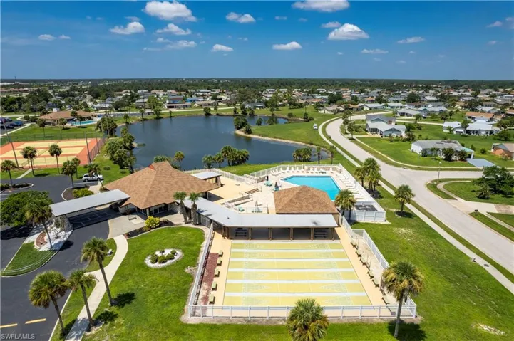 Aerial view featuring a water view and a residential view