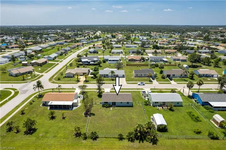 Birds eye view of property with a residential view