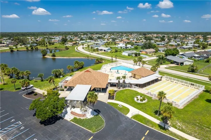 Drone / aerial view with a water view and a residential view