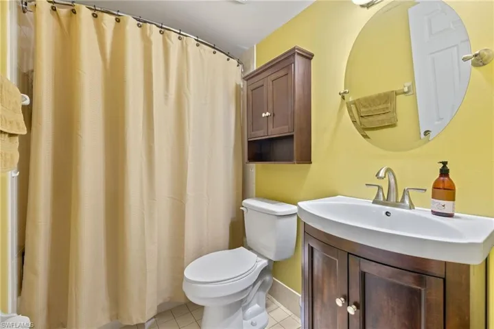 The upstairs bathroom offers a shower/tub combo and newer vanity
