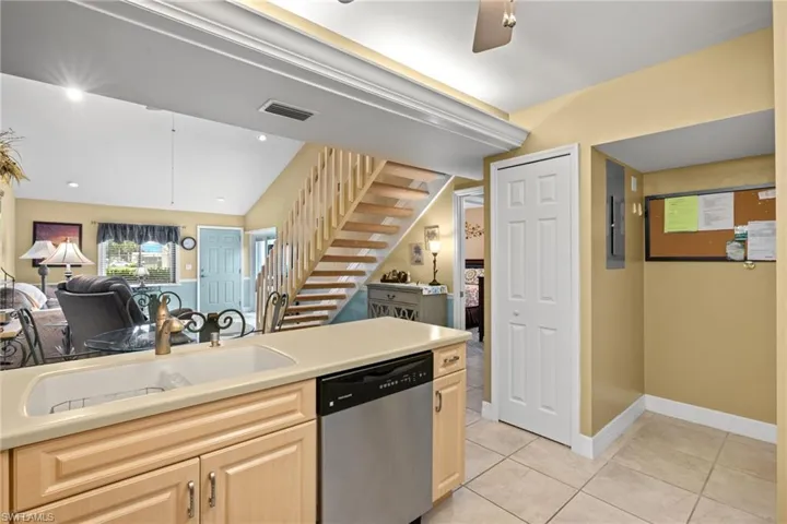 The kitchen offers a pantry and also houses the washer and dryer.