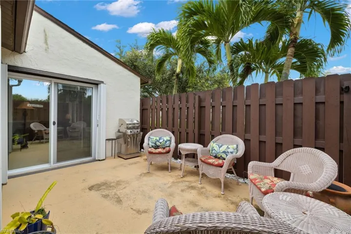 View of patio with area for grilling. Also please note the accordion shutters on the sliders.