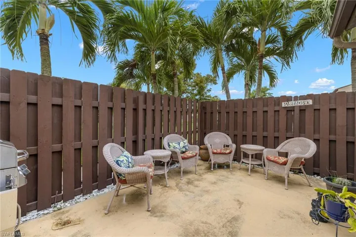 This great fenced patio/courtyard offers you privacy while enjoying the palms waving in the breeze.