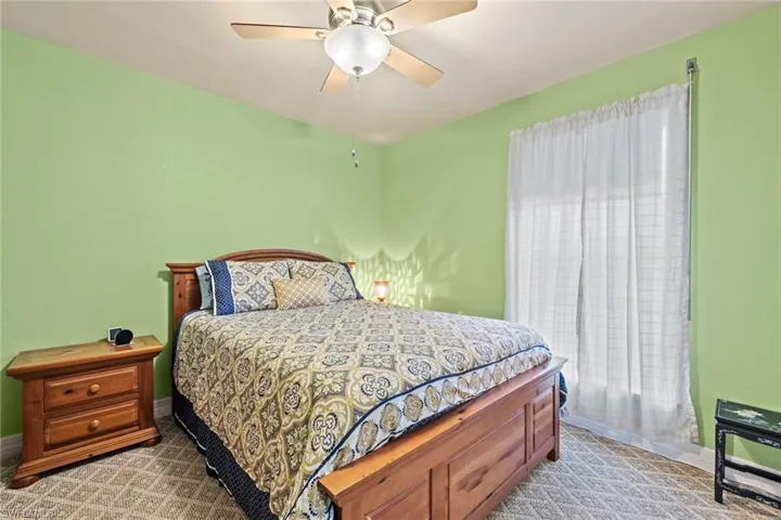 The upstairs bedroom also offers carpet and a ceiling fan.