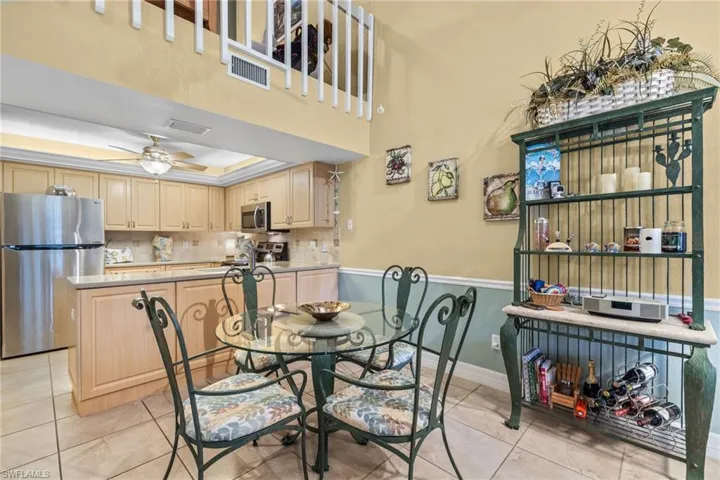 Dining area featuring generous space between the living area and kitchen.