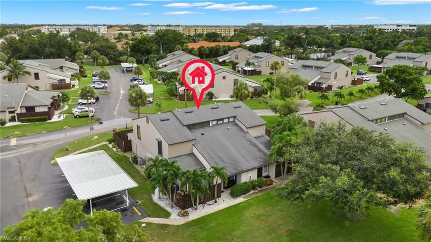 The left bottom corner is your new home. The white roof indicates the carport for this building.