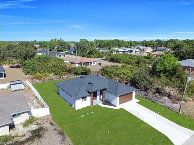 Aerial perspective of suburban area featuring a tree filled landscape