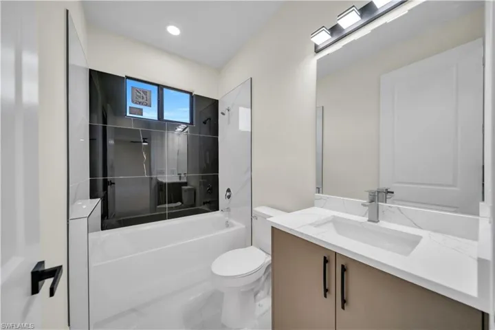 Bathroom with vanity and  shower combination