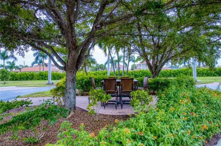 View of yard featuring a patio and outdoor dining space