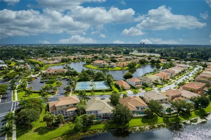 Aerial view of residential area featuring a large body of water