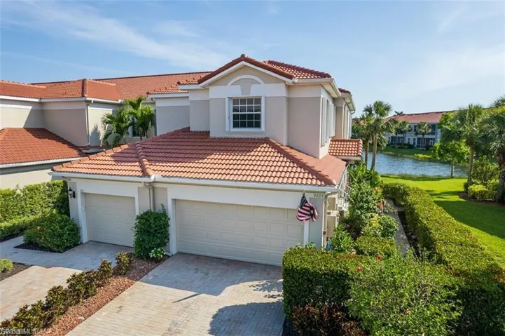 Mediterranean / spanish-style house featuring stucco siding, an attached garage, driveway, and a tiled roof