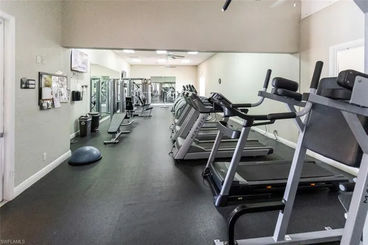Gym featuring a ceiling fan