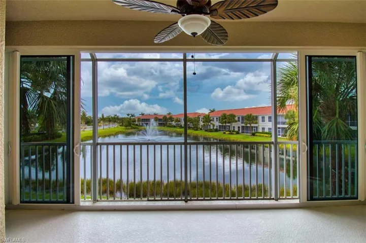 Unfurnished sunroom featuring a water view and healthy amount of natural light