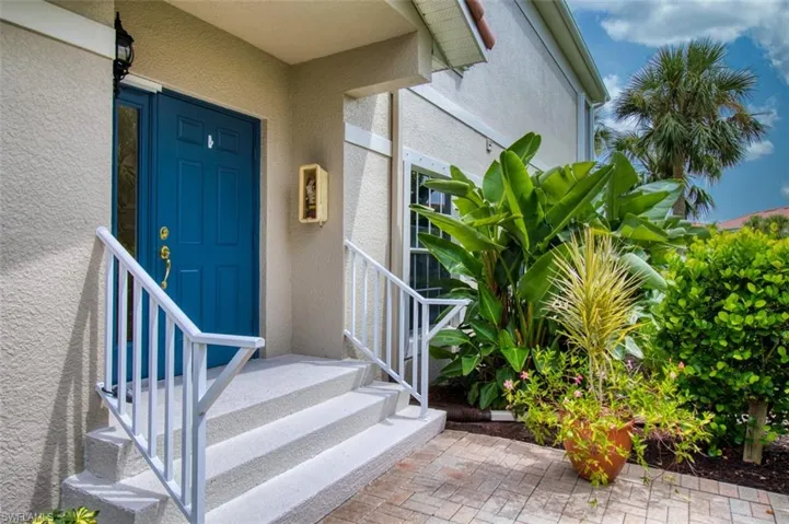 View of exterior entry featuring stucco siding