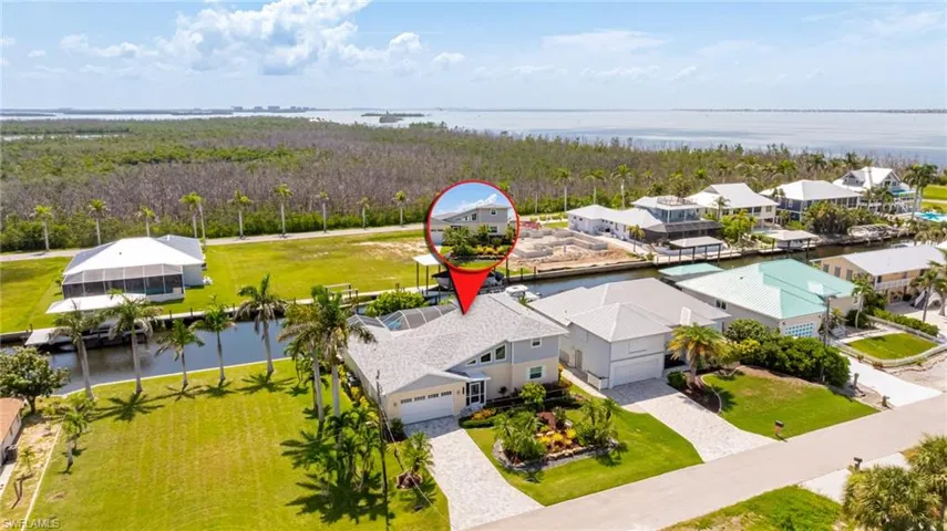Aerial perspective of suburban area with a large body of water