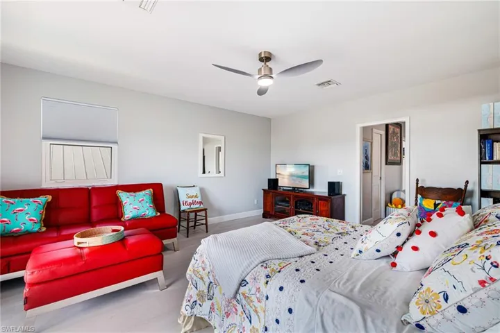 Bedroom with wood finished floors and ceiling fan