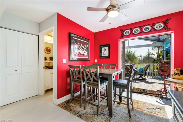 Dining area featuring ceiling fan and light wood finished floors