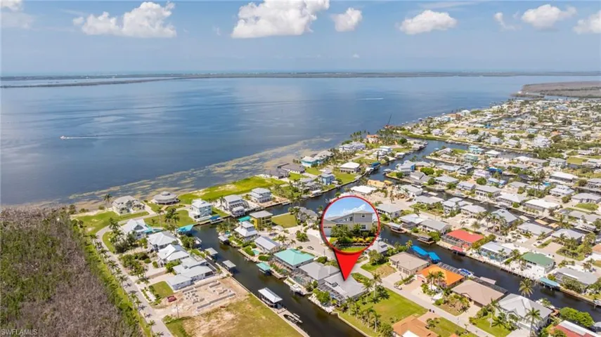 Aerial view of residential area with a large body of water