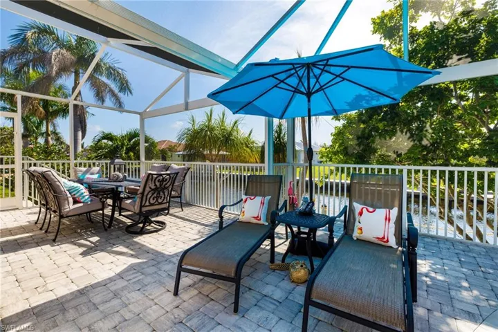 View of patio / terrace with a lanai and outdoor dining area
