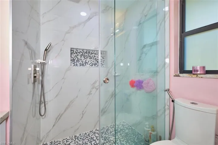 Little ones bathroom - can you tell?  Sellers say they will paint to a more neutral color if requested.  Same effects as the main shower.  Also an impact window and everything is new!